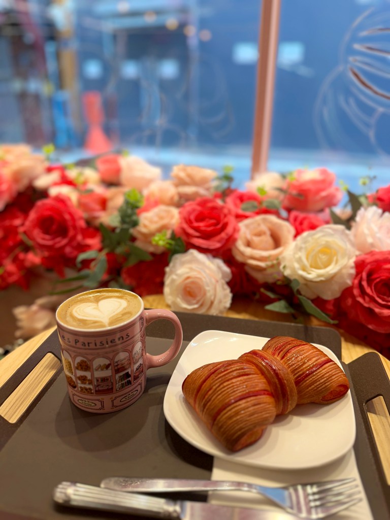 Author's image of her coffee and croissant.