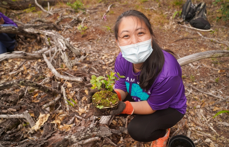 Miyasato holding an ʻōhi'a lehua sapling 20220425_192436000_iOS