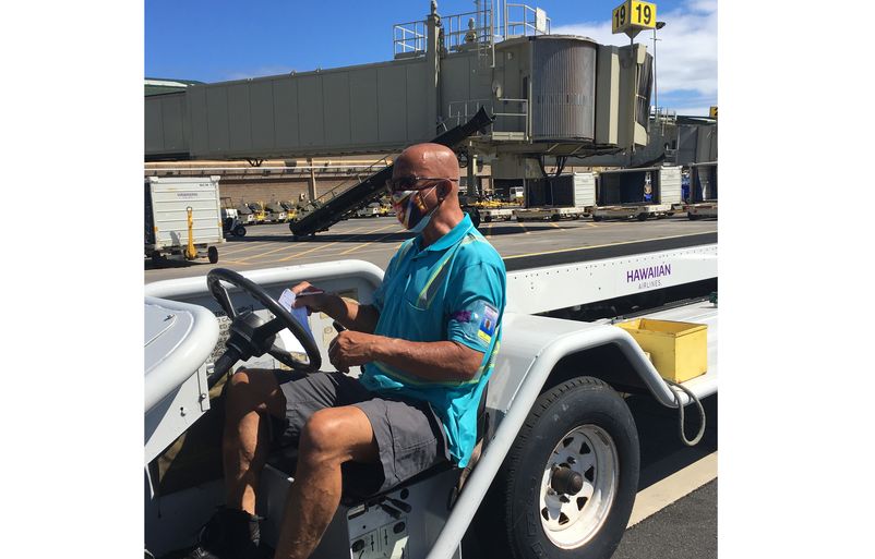 Keane Lee, one of our ramp agents at Kahului Airport, wearing a mask while completing his daily duties on Friday morning. AO