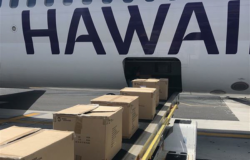 Amenity kits loading onto HA1106 to OGG aircraft N476