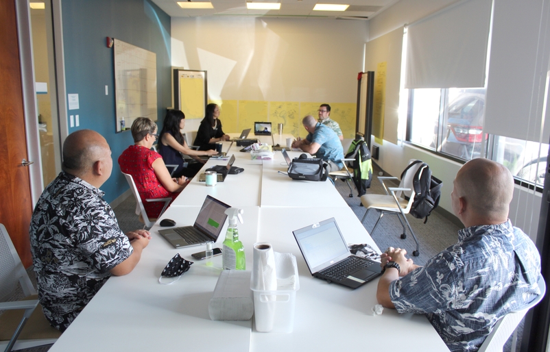 Members of the CCCT conducting daily briefings from the temporary emergency response room at corporate headquarters. CCCT_GroupPic03.jpg_edit