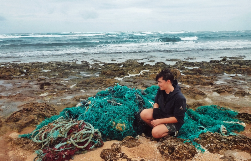 Thomas pictured next to piles of fishing nets and mooring rope during her first Sea Cleaners to the North Shore of O‘ahu. Charlie 1
