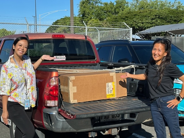 Brand and Community Specialist Janelle Bayne (left) helped coordinate Hawaiian Airlines' first donation of expired aviation life vests to Chin (right) and Smith. IMG_2999