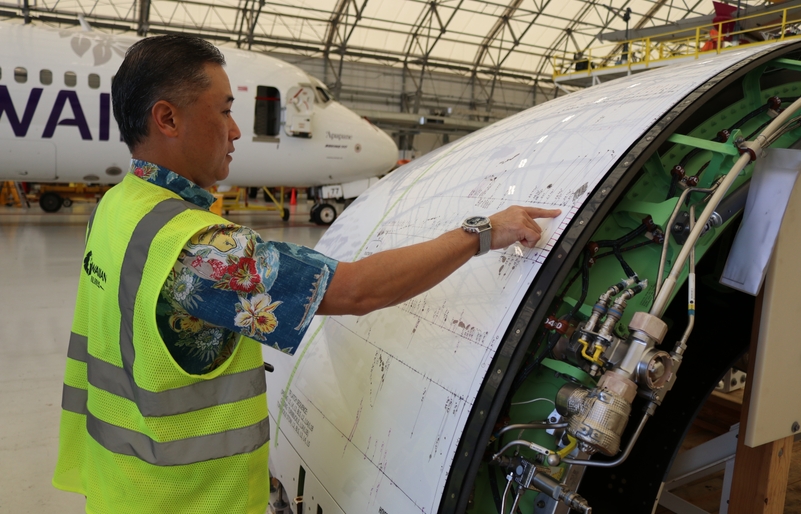During a visit to our Honolulu maintenance hangar, Jonathan Yang, director of line maintenance, inspects slight damage to an aircraft's shell. His team is hard at work servicing our fleet, including reporting, mapping out and repairing any fuselage damage. IMG_3478
