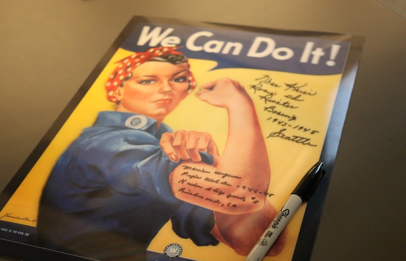 Krier and Wynn signed a 'Rosie the Riveter' poster that will be displayed at the hangar IMG_4202