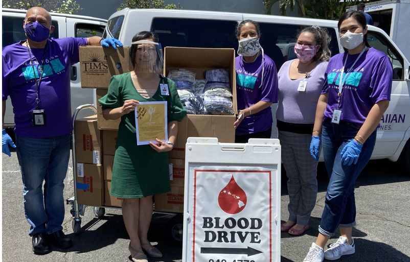 Members from Team Kōkua, pictured with Kim-Anh Nguyen, president and CEO of the Blood Bank of Hawaii, dropped off masks along with cookies and potato chips from our excess in-flight inventory. IMG_5642