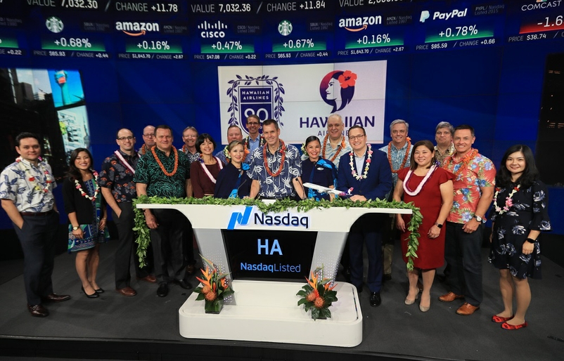 Okinaka (front row, third from right) with Hawaiian Airlines leadership team and employees who traveled to New York City in December 2018 to ring the Nasdaq Closing Bell. Nasdaq