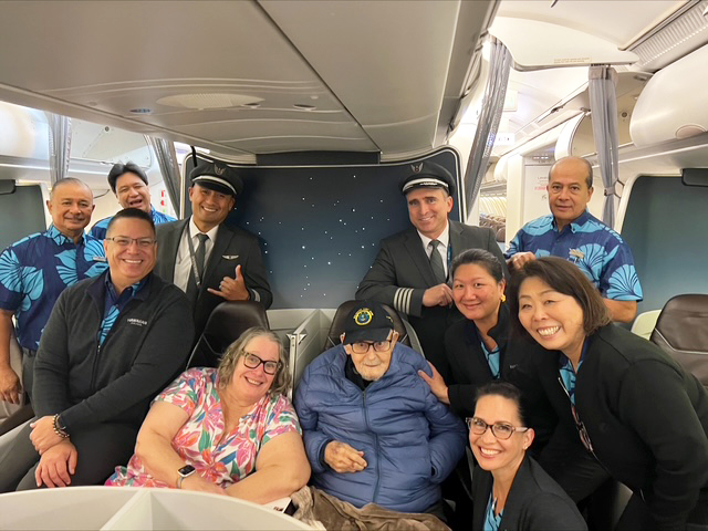 Schab, photographed with the HA49 crew and his daughter, was welcomed warmly by crewmembers and guests onboard the flight. PDX crew