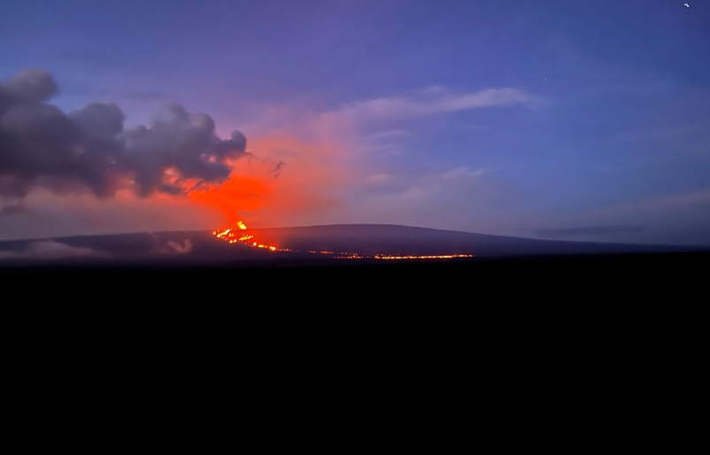 The ongoing Northeast Rift Zone eruption of Mauna Loa, as viewed from the Daniel K. Inouye Highway (Saddle Road) shortly after 6 a.m. HST on Dec. 4. USGS2
