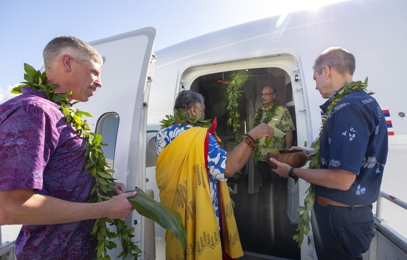 (From left to right) Darren Hulst, vice president of commercial marketing at Boeing, Kahu Laʻakea Arista, Kumu Keoni Martin, and Peter Ingram, president and CEO of Hawaiian Airlines, during the blessing of Kapuahi. Blessing