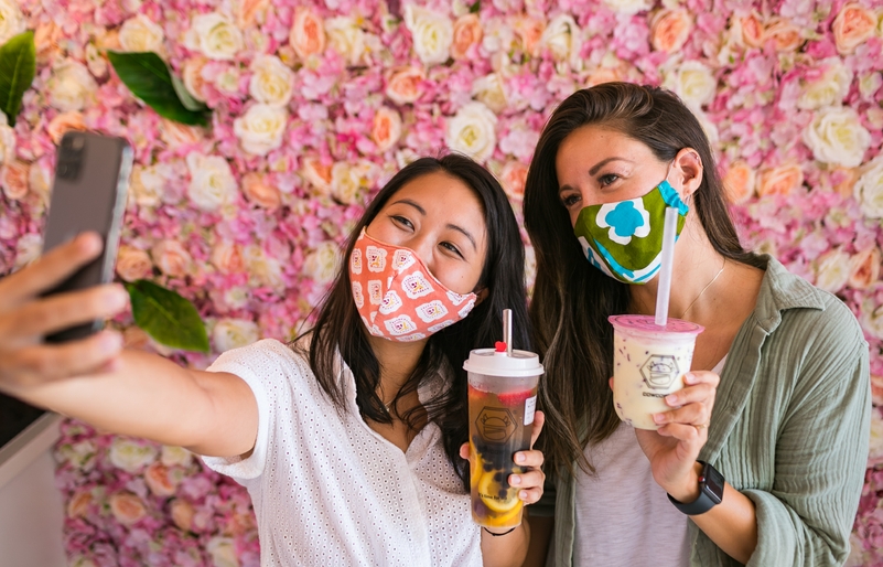 The rose wall at Cowcow's Tea is a popular backdrop for customers. Don't forget to bring a reusable bubble tea straw, if you have one! hawaiianairlines-web-preview-146